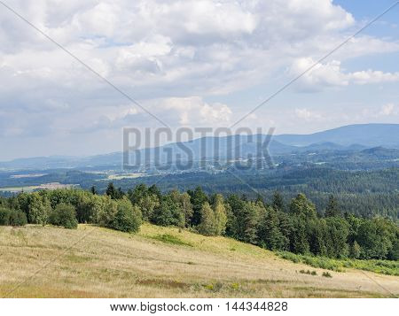 Beautiful hilly landscape with field and forest in Jelenia Gora Poland