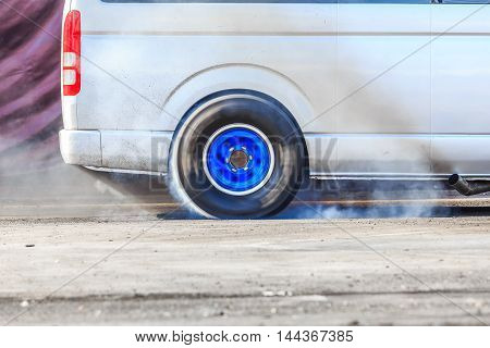 Drag Racing Car Burns Rubber Off Its Tires In Preparation For The Race