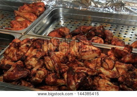 Fresh grilled poultry products on display at a poulterer store