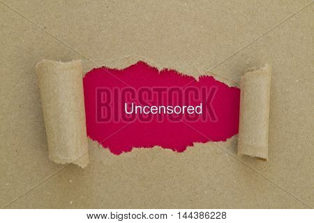 uncensored word written under torn paper .