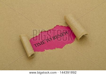 TIME TO RENEW message written under torn paper.