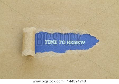 TIME TO RENEW message written under torn paper.