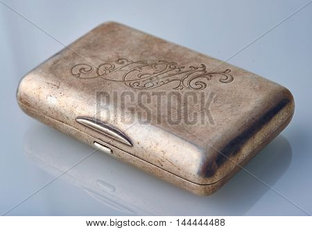 Vintage metal cigarette case with an engraving on the lid