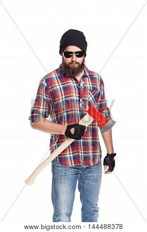 young bearded lumberjack posing with ax in studio