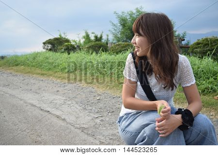 young beautiful woman at outer natural place