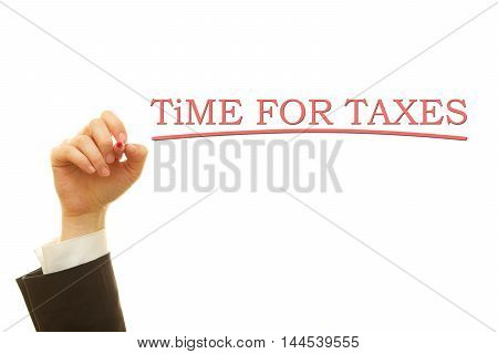 Hand writing Time For Taxes on a transparent wipe board. Tax Refund.