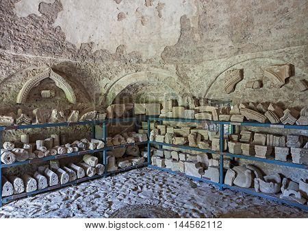 BAR, MONTENEGRO - APRIL 25, 2015: Lapidarium was opened in 2013 in the building of gunpowder warehouse in the old town of Bar. It presents fragments of stone window frames, doorways, columns and other elements of buildings dating from 5 - 9 centuries