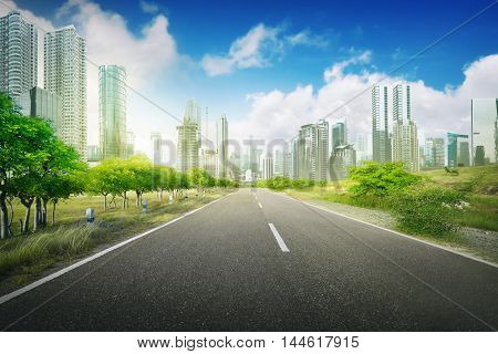 Empty road in the city on the daytime blue sky and city background