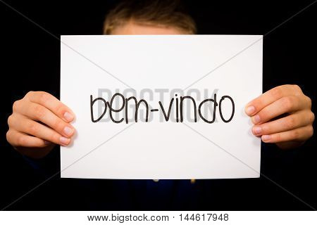 Child Holding Sign With Portuguese Word Bem-vindo - Welcome