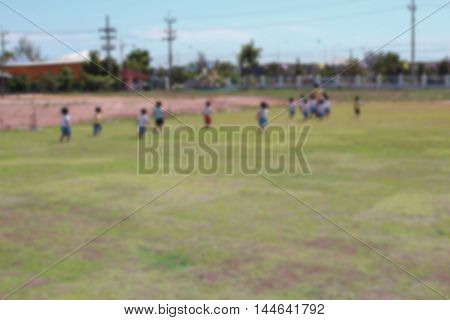 Blur blurred  Student Kindergarten. running on grass in school Teachers have run lead.