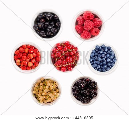 Strawberries, currants, raspberries blueberries and blackberries. Collage of different fruits and berries isolated on white. Ripe and tasty berry.
