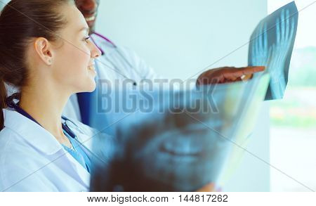 Doctors analyzing an x-ray in a meting