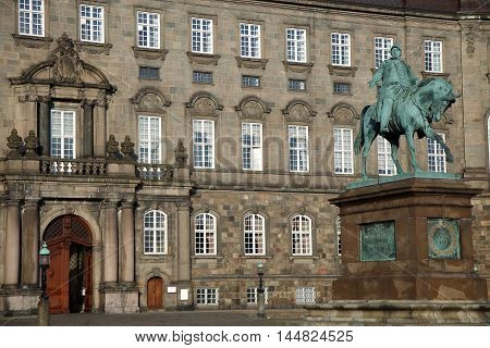 The equestrian statue of King Frederik VII in front of the Christiansborg Palace in Copenhagen Denmark