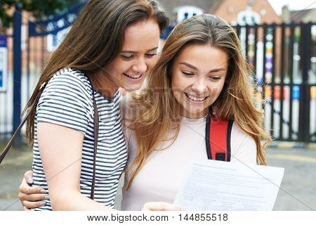Two Happy Teenage Girls Celebrating Exam Results