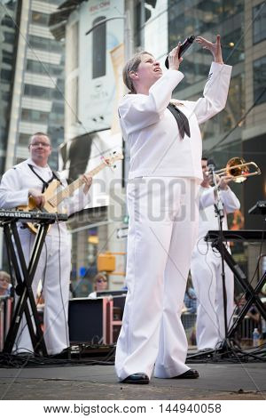 NEW YORK MAY 27 2016: Navy Band Northeast Rhode Island Sound perform a public concert on Military Island Pedestrian Plaza in Times Square during Fleet Week 2016 in Manhattan.