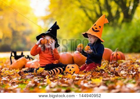 Kids With Pumpkins On Halloween