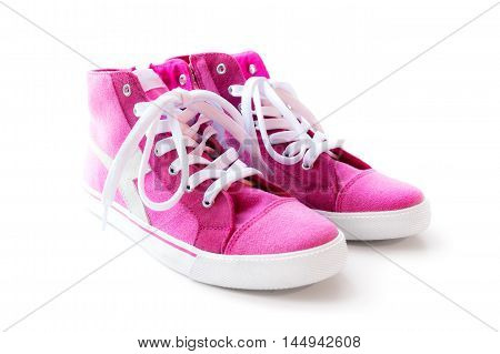 Pink high-top sneakers on the white background