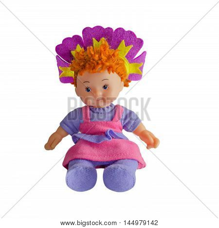 Girl doll, made from cloth, is sitting. On an isolatedbackground
