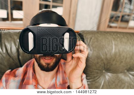 Man try vr glasses first time, close-up. Test of new innovational device for entertainment, free space. Modern technology, innovation, cyberspace, entertainment concept