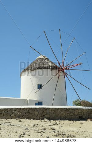 Mykonos, Greece. Traditional windmill before blue sky. The windmills are the island's landmark.