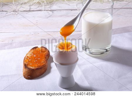 Morning Breakfast Set With Egg, Orange Jam On Bread Toast And Milk In Glass