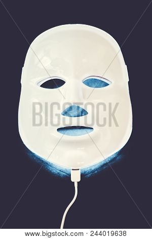 Light Rejuvenating Mask For Facial Skin Therapy On Black Background