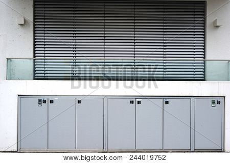 A New And Modern Balcony Of An Apartment Of An Apartment Building With A Bright White Facade And Loc