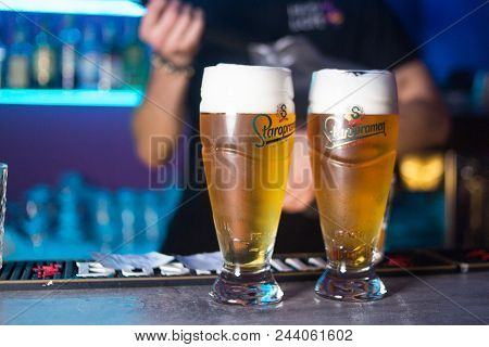 Kiev.ukraine - March 30, 2018: Glass Of Staropramen Premium Beer On Bar Background With Reflection. 