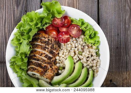 Healthy Food. Salad Plate With Grilled Steak, Avocado, Cherry Tomatoes, Mix Cereal On Wooden Table. 