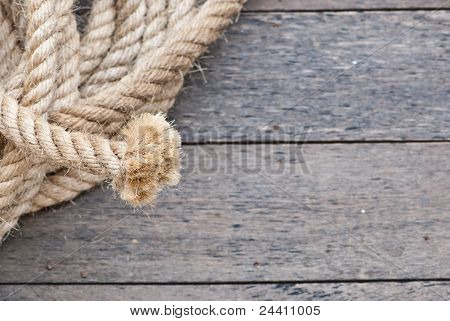 Big Navy Rope On Wooden Plank.