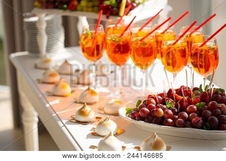 Image Of Strawberry Cocktails, Strawberries And Grapes, Cakes At A Buffet Table