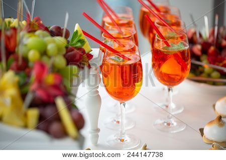 Image Of Strawberry Cocktails, Strawberries And Grapes, Cakes At A Buffet Table