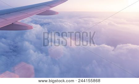 Sunset sky with beautiful clouds from the airplane window