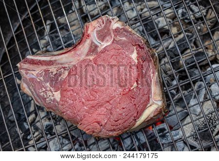 Close-up Of A Raw Beef Rib On A Barbecue Grill