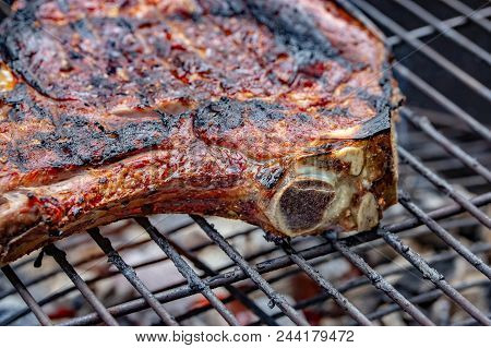Close-up Of A Grilled Beef Rib On A Barbecue Grill