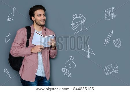 Reading Historical Novels. Cheerful Emotional Teacher Of History Feeling Happy While Holding A New B
