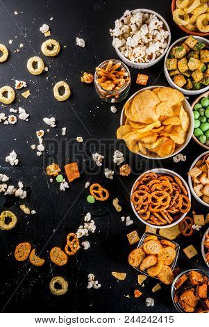Variation Different Unhealthy Snacks Crackers, Sweet Salted Popcorn, Tortillas, Nuts, Straws, Bretse