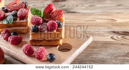 Belgian Waffles With Strawberry Jam, Fresh Strawberries, Raspberries, Blueberries And Chocolate Chip
