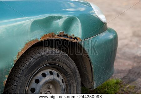 Rusty Right Wing Of Car With Corrosive Defect. Corrosion And Rust