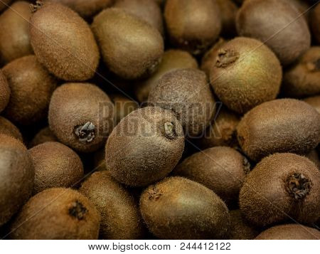 Closeup Colorful Display Of Kiwi Fruit In Market. Background.