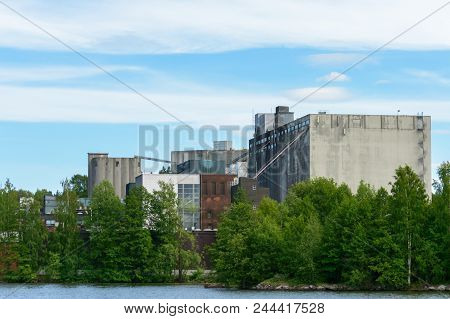 There Is A Big Malt Factory Behind Trees