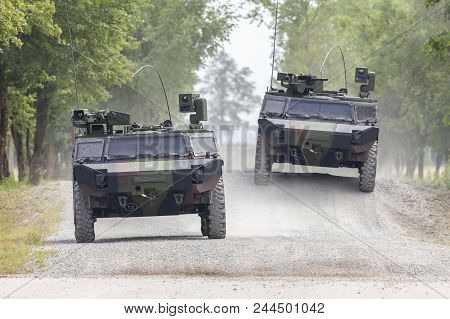German Light Armoured  Reconnaissance Vehicle Drives On A Road