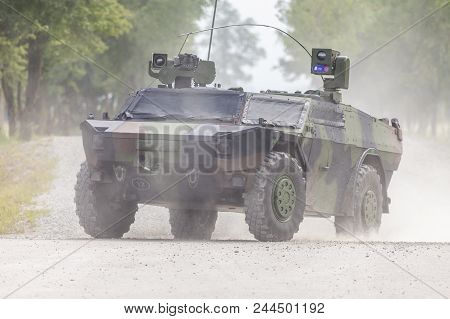 German Light Armoured  Reconnaissance Vehicle Drives On A Road