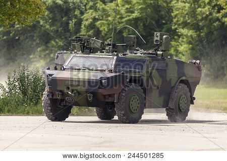 German Light Armoured  Reconnaissance Vehicle Drives On A Road