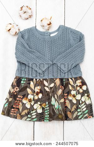 Baby Dress  Botanique Palette And Cotton Flower On  Wooden Background. Vertical Photo