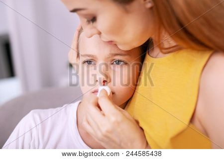 Blood Pressure. Cheerless Pretty Girl Suffering From Pain While Having Problems With Blood Pressure