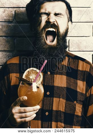 Cocktail Fresh. Man Holds Alcohol Cocktail On Brick Wall Background. Masculinity Drink Concept. Hips