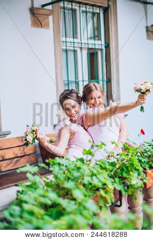 Stylish Bridesmaids Having Fun In Old Square. Rendy Wedding, Same Bridesmaids Dresses. Wedding Day.
