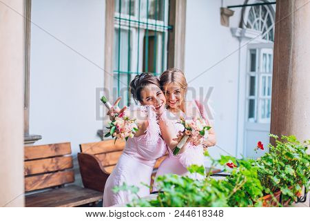 Stylish Bridesmaids Having Fun In Old Square. Rendy Wedding, Same Bridesmaids Dresses. Wedding Day.