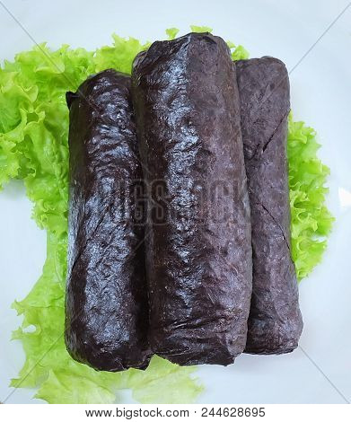 Japanese Cuisine, Top View Of Traditional Unsliced Japanese Rice Maki Sushi Roll With Nori Seaweed S